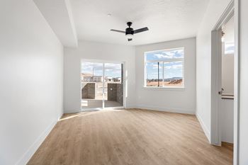Room with glass door and large window